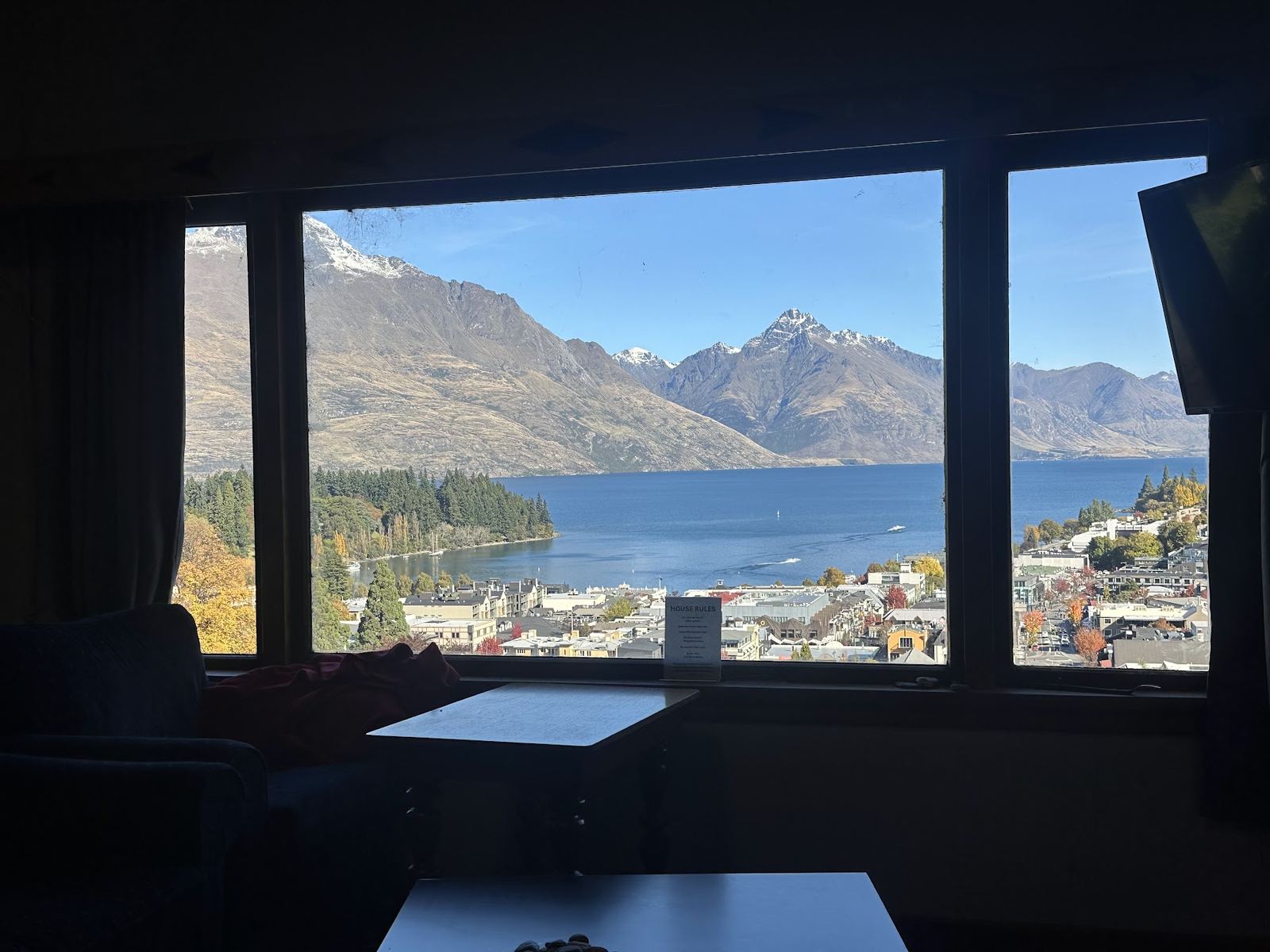 Lake Wakatipu framed in the common room window at Hippo Lodge